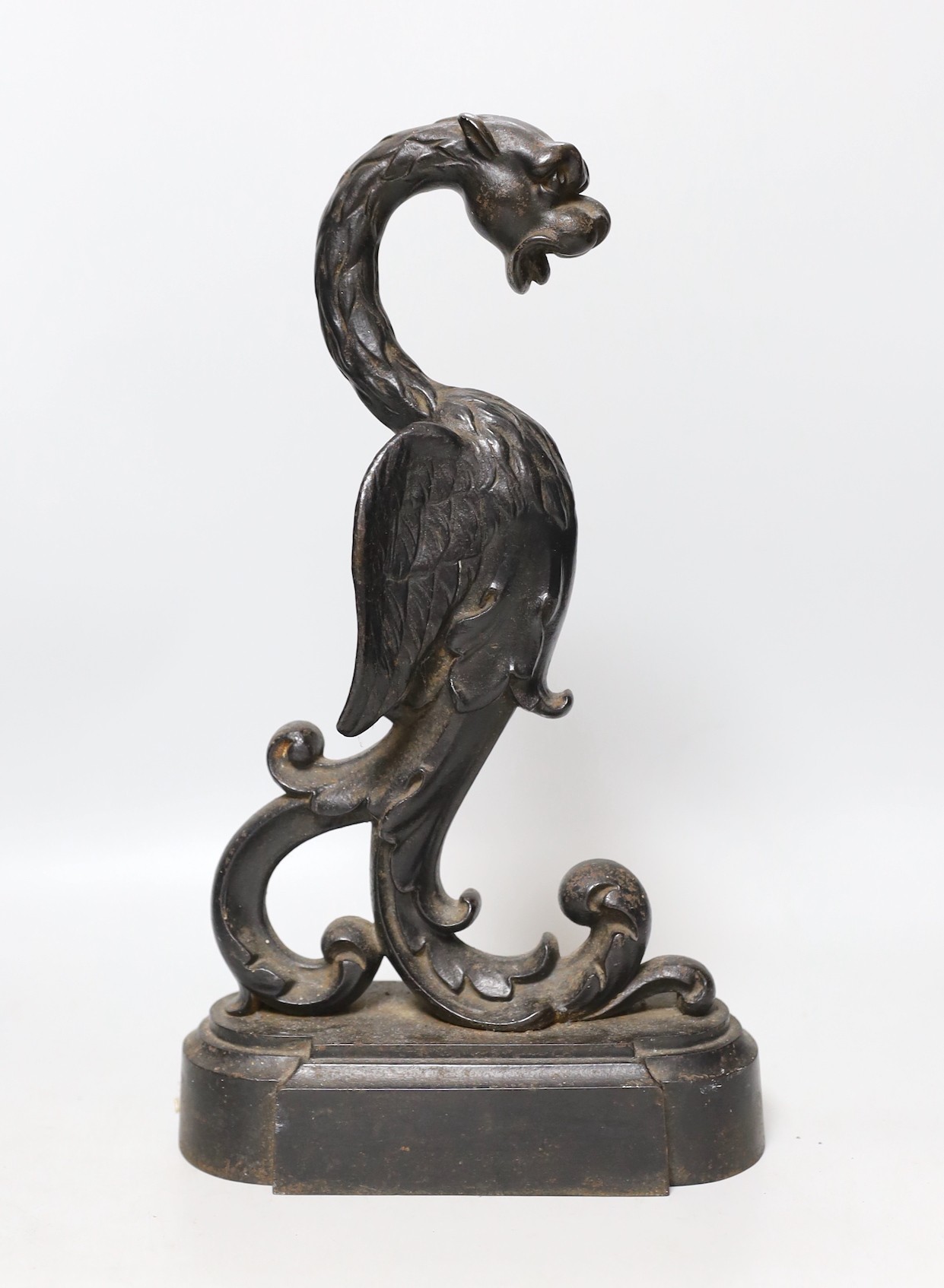 A Victorian cast iron ‘wyvern’ door stop, 32cms